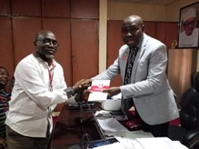 Mr Isyaku Sharu r in a handshake with Abdulhakeem Garba chair Correspondents Chapel of the Nigerian Union of Journalists Kwara State Chapt