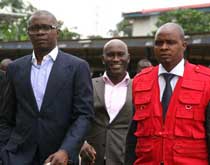 WALTER WAGATSOMA (LEFT) OF ONTARIO OIL AND GAS NIG LTD OUTSIDE THE COURTROOM 